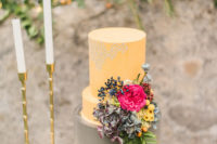 10 The wedding cake was done in grey and yellow and with bold blooms on the side