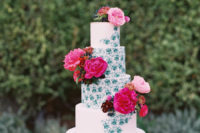 10 The wedding cake was half painted and decorated with the same fuchsia and pink florals