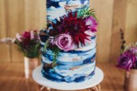 10 a very bold watercolor wedding cake in the shades of blue, with copper touches and pink and burgundy blooms
