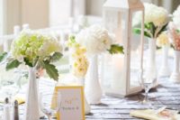 10 an elegant table setting with a grey tablecloth, yellow napkins and some creamy touches to soften the look
