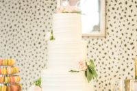 11 The wedding cake was a buttercream one, with blush and ivory blooms and an arrow topper
