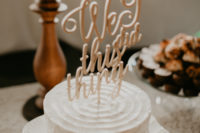 11 The wedding cake was a white buttercream one with a calligraphy topper