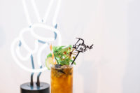 Neon signs, mid-century drink stirrers were included into the wedding decor