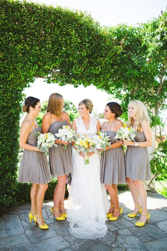bridesmaids wearing knee dres strapless dresses and neon yellow strappy shoes