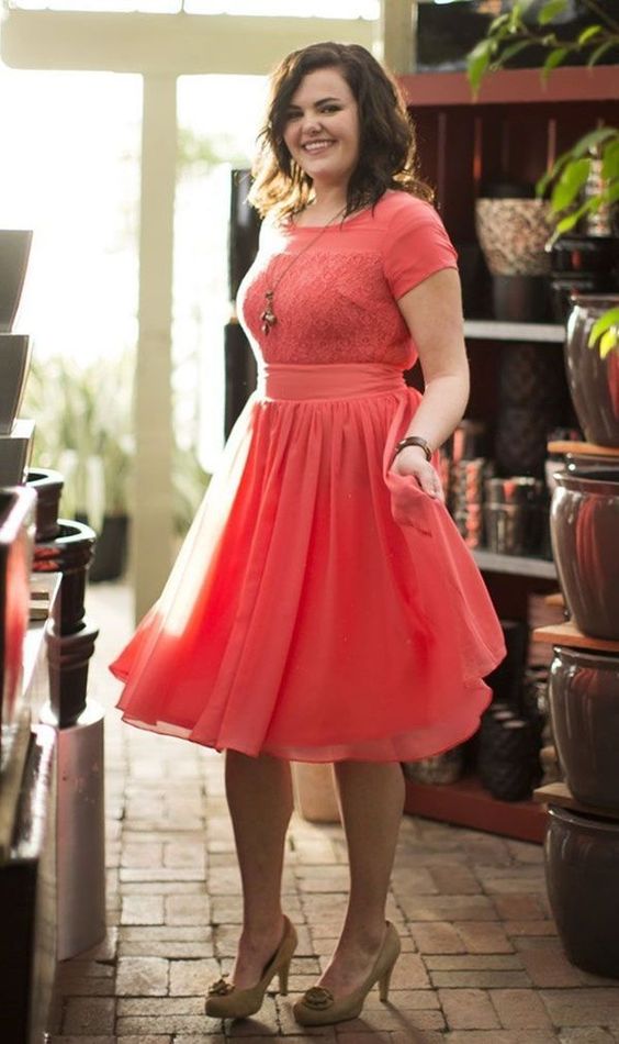 a coral midi dress with a tulle skirt, a lace bodice with a scoop neckline and short sleeves for a cute look