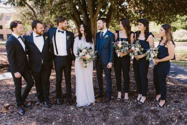 black jumpsuits with bow ties on the shoulders for bridesmaids and black tuxedos for groomsmen