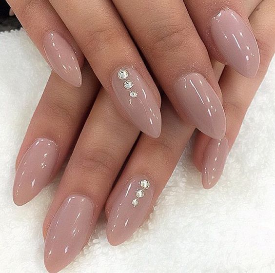 nude nails with just a little bling so it won't compete with your ring
