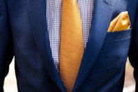 15 a preppy groom’s look with a printed shirt, a blue suit, a yellow tie and a handkerchief instead of a boutonniere