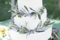 15 a textural buttercream wedding cake decorated with lavender and greenery for a rustic wedding