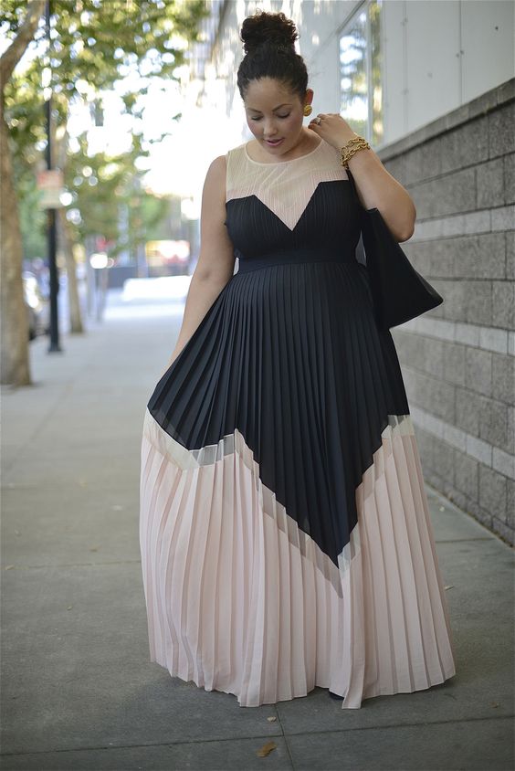 a gorgeous geometric bridesmaid's dress in blush and black with no sleeves and a high neckline looks wow
