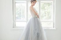 16 a light blue ballgown with a lace bodice, no sleeves and a layered tulle full skirt with a train