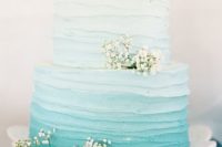 17 an ombre blue watercolor wedding cake with baby’s breath is ideal both for a rustic or a beach wedding