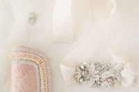 18 a blush beaded and pearled clutch to add a colorful touch to the bridal look