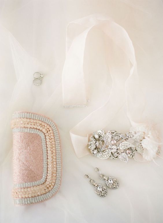a blush beaded and pearled clutch to add a colorful touch to the bridal look