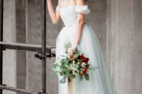 18 a light blue off the shoulder A-line wedding dress with an embellished belt and a full skirt