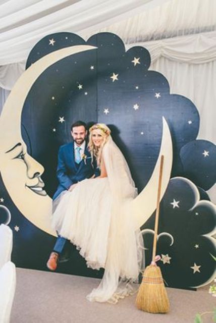 a vintage styled crescent moon with a night sky and stars as a wedding photo booth backdrop