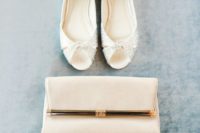 19 a casual off-white clutch with golde detailing is a chic idea that can be used afterwards, too
