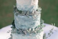 19 a textural ombre buttercream wedding cake topped with eucalyptus for a chic look