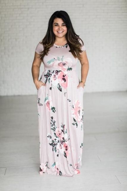 a blush floral maxi dress with short sleeves and an illusion neckline for a garden wedding