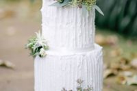 20 a textural white wedding cake decorated with succulents, herbs, greenery and little blooms for a modern wedding
