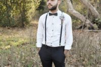 20 black pants and suspenders, a black bow tie and a white with black buttons