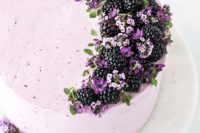 21 a tender cake frosted with blackberry buttercream, topped with fresh blackberries and edible flowers shaped as a crescent moon
