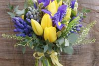 22 a bridal bouquet of yellow tulips, purple iris, green thlaspi, blue hyacinth and pussy willow
