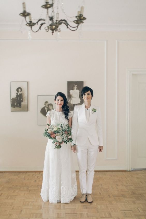 a creamy bridal pantsuit with a white top, nude shoes and a succulent boutonniere