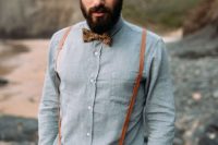 22 graphite grey pants, a chambray shirt, amber leather suspenders and a printed bow tie