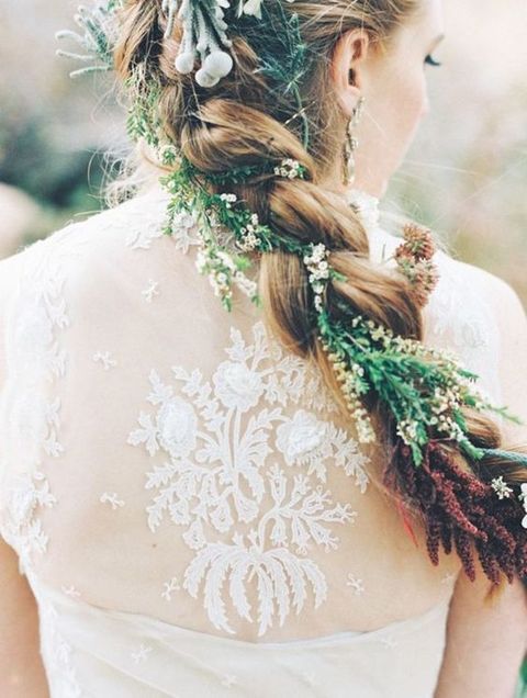 Add a woodland touch to your bridal look with some greenery and blooms in your hair