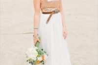 24 a wedding dress with a flowy skirt, a sequin strapless bodice and a brown leather belt to make a statement