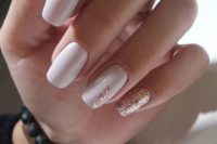 24 creamy nails with rose gold accents here and there is a very feminine option to go for