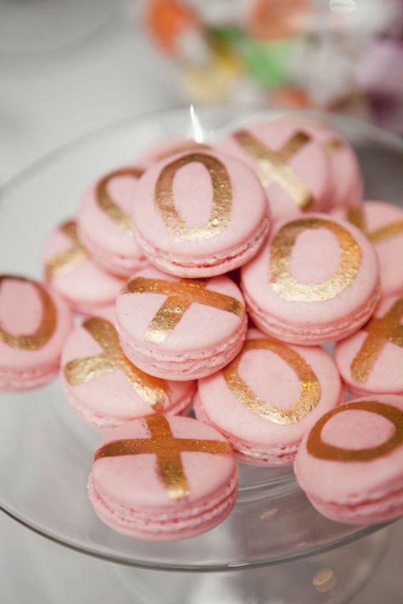 pink macarons with metallic letters for serving at a glam bridal shower