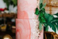 25 a pink marbleized wedding cake decorated with tropical leaves and gold leaf for a tropical wedding