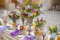 26 an exquisite table setting of lavender and yellow plus amber and grey touches with a very lush and textural centerpiece
