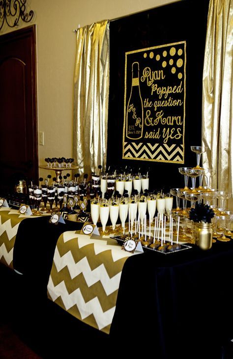 super glam black and gold bridal shower with a matching cocktail and dessert table