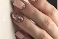 27 pink nails and rose gold accent half moons and an accent glitter nail for a gorgeous feminine feel