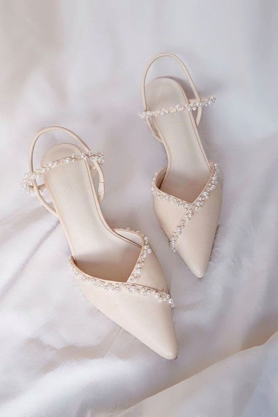 refined ivory flat slingbacks with pearls and pearl straps are adorable for a tender and delicate bridal look