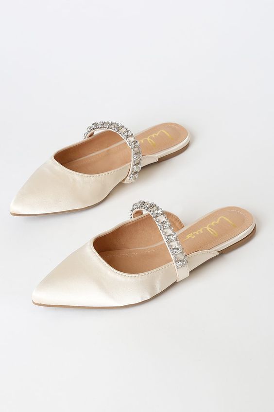 trendy neutral flat mules with embellished straps will make your bridal look ultimate and chic