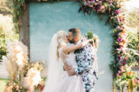 01 This bold and whimsical wedding was filled with florals all over and took place at a vineyard