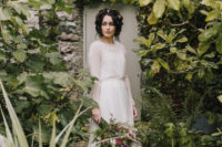 02 The bride was wearing a modest wedding dress with a sheer overdress, illusion sleeves and a lace trim