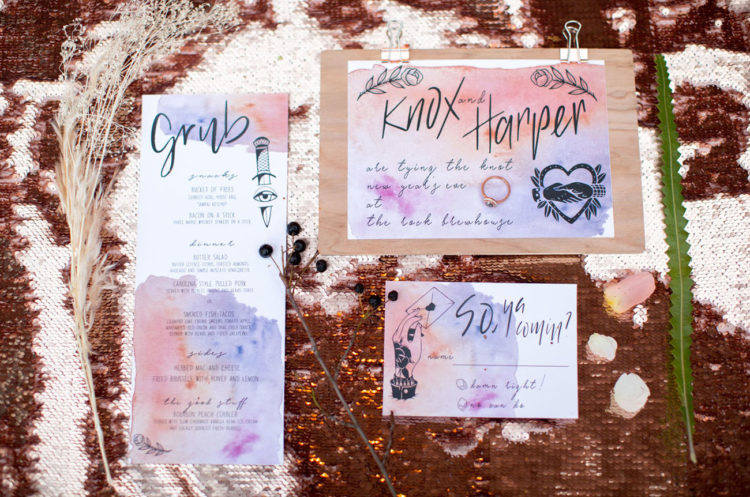 The wedding invitation suite was a watercolor one, in pink and purple with graphic images