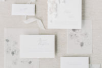 02 The wedding stationery set was done with calligraphy, airy petals attached to the invitations and some graphic blooms