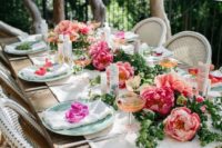 02 a beautiful and simple tablescape with a greenery and peony table runner, blooms on each setting and neutral textiles