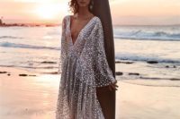beach wedding gown with bell sleeves