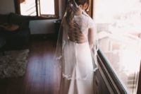03 She was rocking a fitting wedding dress with a sheer lace illusion bodice and a lace up back plus a small train