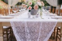 03 a lace table runner is a chic idea for a vintage touch to add to your reception tables