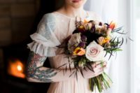 04 The bridal bouquet was done with blush, mustard, black and pink blooms plus textural herbs