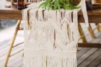 04 a macrame table runner is great for a boho wedding, add greenery or blooms on top