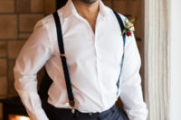 05 The groom was wearing black pants, a white shirt, black suspenders and a boutonniere